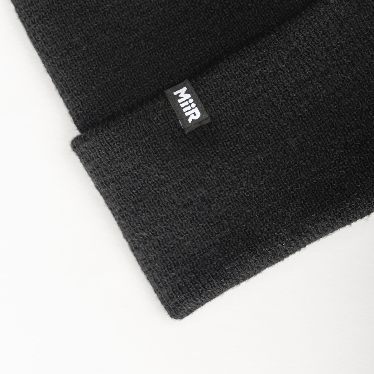 recycled-poly-fine-knit-beanie-a8 WebPDP-RecycledPolyFineKnitBeanie_Studio_TagDetail_Black__BNE005002OS.jpg