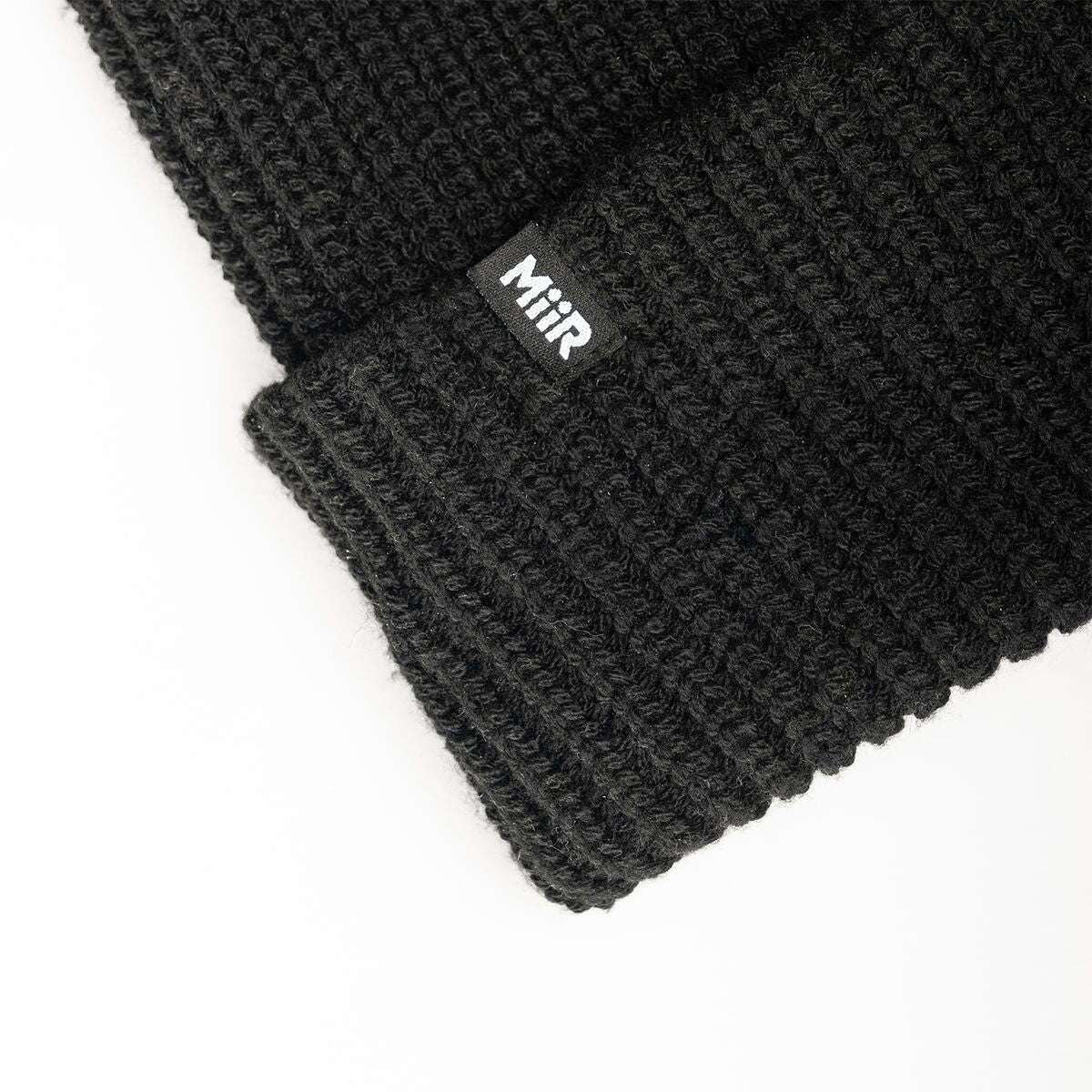 recycled-poly-rib-beanie-r3 WebPDP-RecycledPolyRibBeanie_Studio_TagDetail_Black__BNE002002OS.jpg